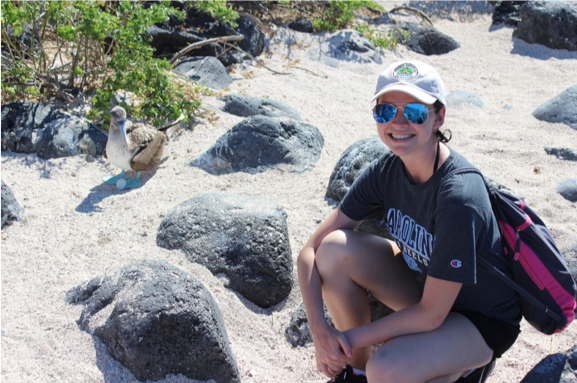 Danford posing with a nesting blue-footed booby on Isla Lobos, Galápagos